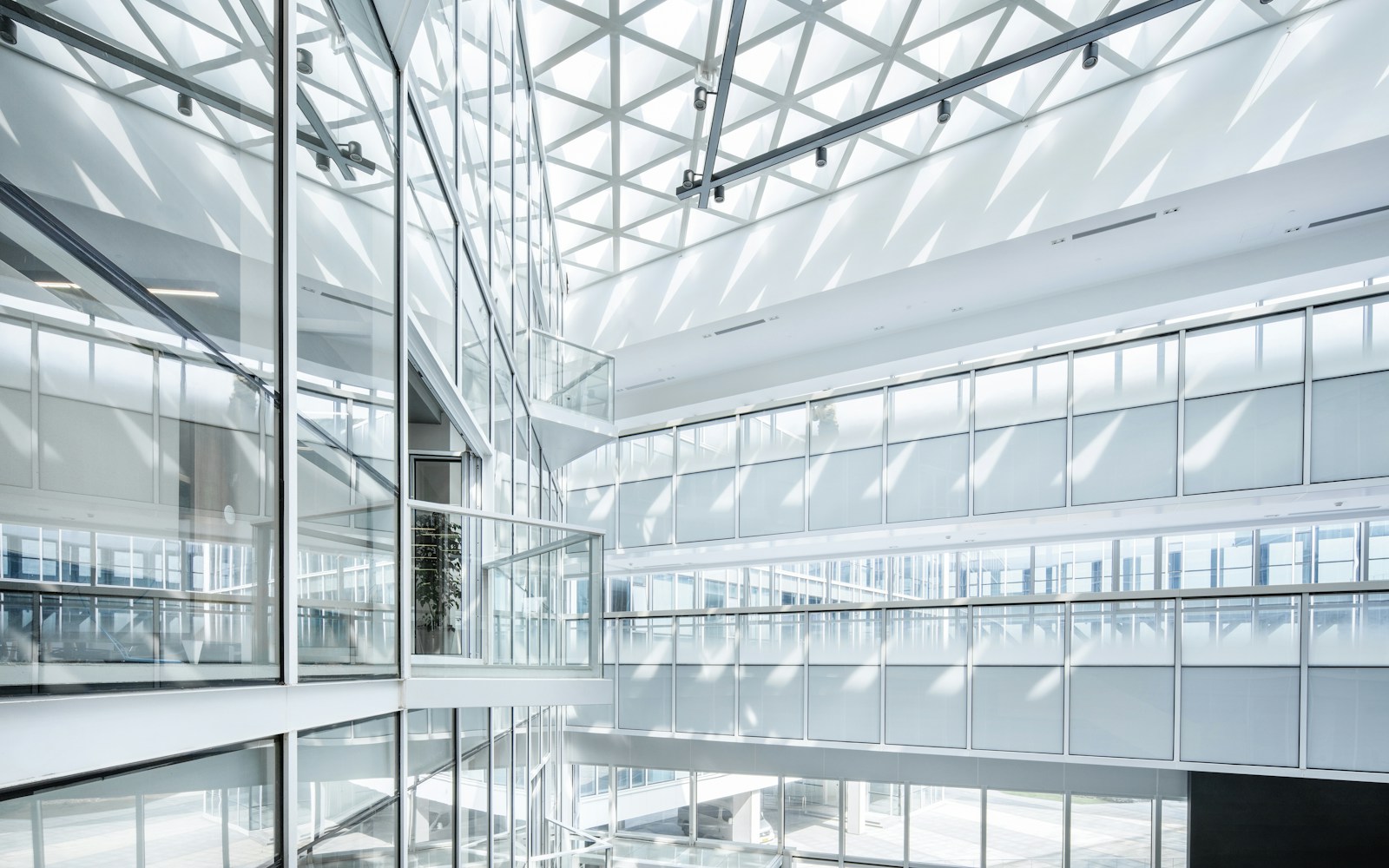 Modern commercial building atrium with solar-control window film